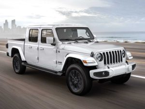 2020 Jeep Gladiator white driving off-road in rugged terrain