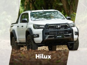 TOyota Hilux tackling a muddy forest trail during off-road adventure
