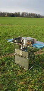 Our Dare to be Different kitchen box fully opened on grass, ready for outdoor cooking